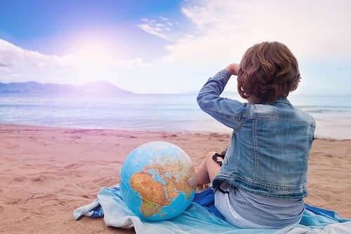 girl with globe looking across the sea - 澳洲幸运5体彩开奖网168 Kids World Travel Guide